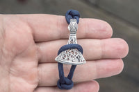 Pulseira roxa com machado e runa dos artesãos Uruz