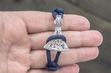 Pulseira roxa com machado e runa dos artesãos Uruz